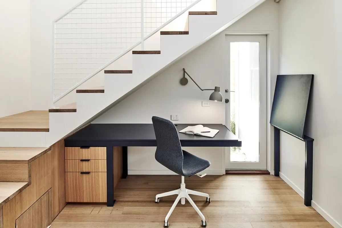 the-study-nook-features-a-long-desk-that-provides-access-to-the-homes-side-entrance-when-partially-folded-up