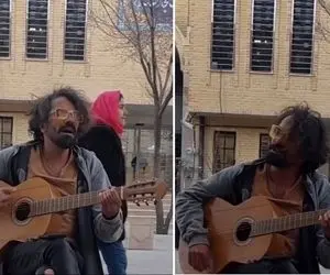 آواز بهشتی؛ دوره گرد شلوار پاره با ساز گیتارش جلوی بانک تجارت تحریر میره استادانه