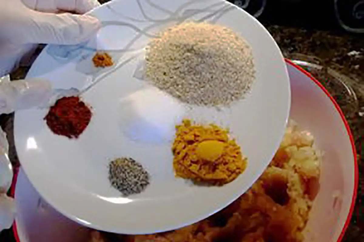 adding-spices-to-chicken-cutlet