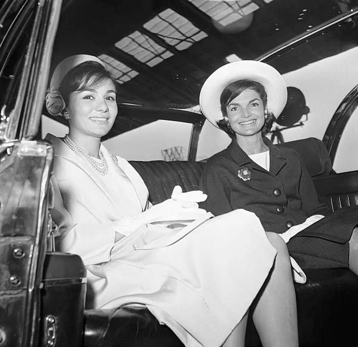 Mrs_ Kennedy and Empress Farah ride in a limousine from Washington