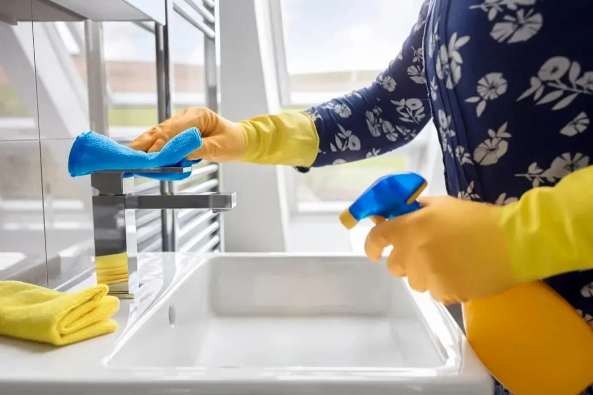 person-cleaning-bathroom1-1