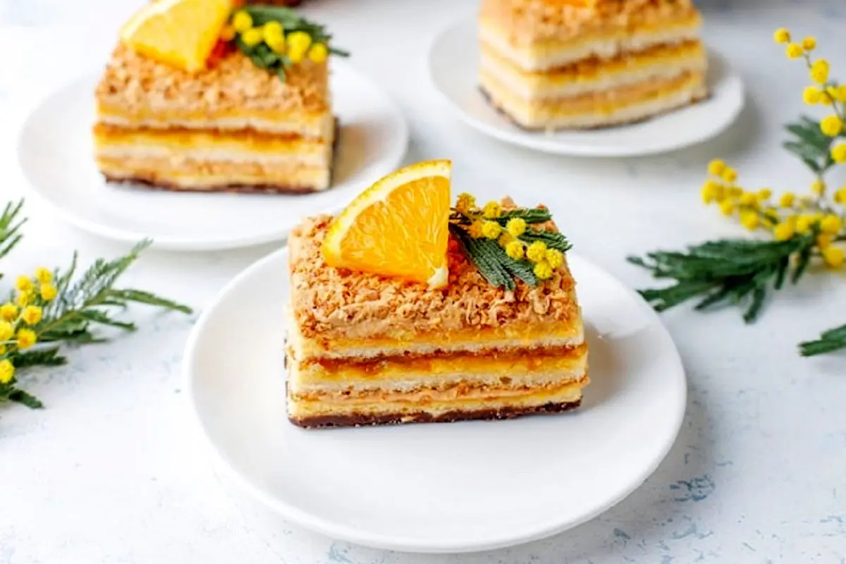 orange-cake-decorated-with-fresh-orange-slices-mimosa-flowers-light_114579-7715