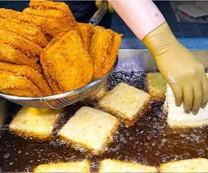 غذای خیابانی ؛ ببینید کره ای ها چجوری سالاد الویه رو تو روغن داغ سوخاری می کنند