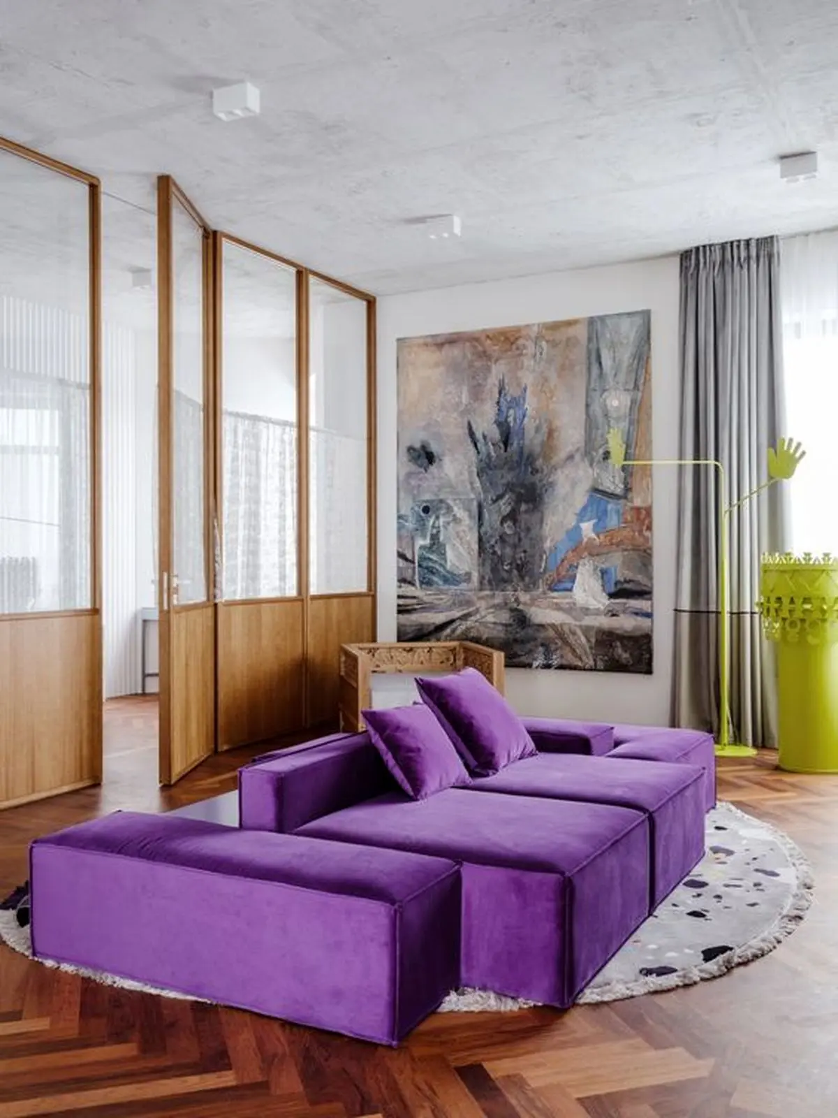 20-a-contemporary-living-room-with-a-neutral-base-a-bold-purple-sofa-a-statement-artwork-grey-curtains-and-a-neon-yellow-table
