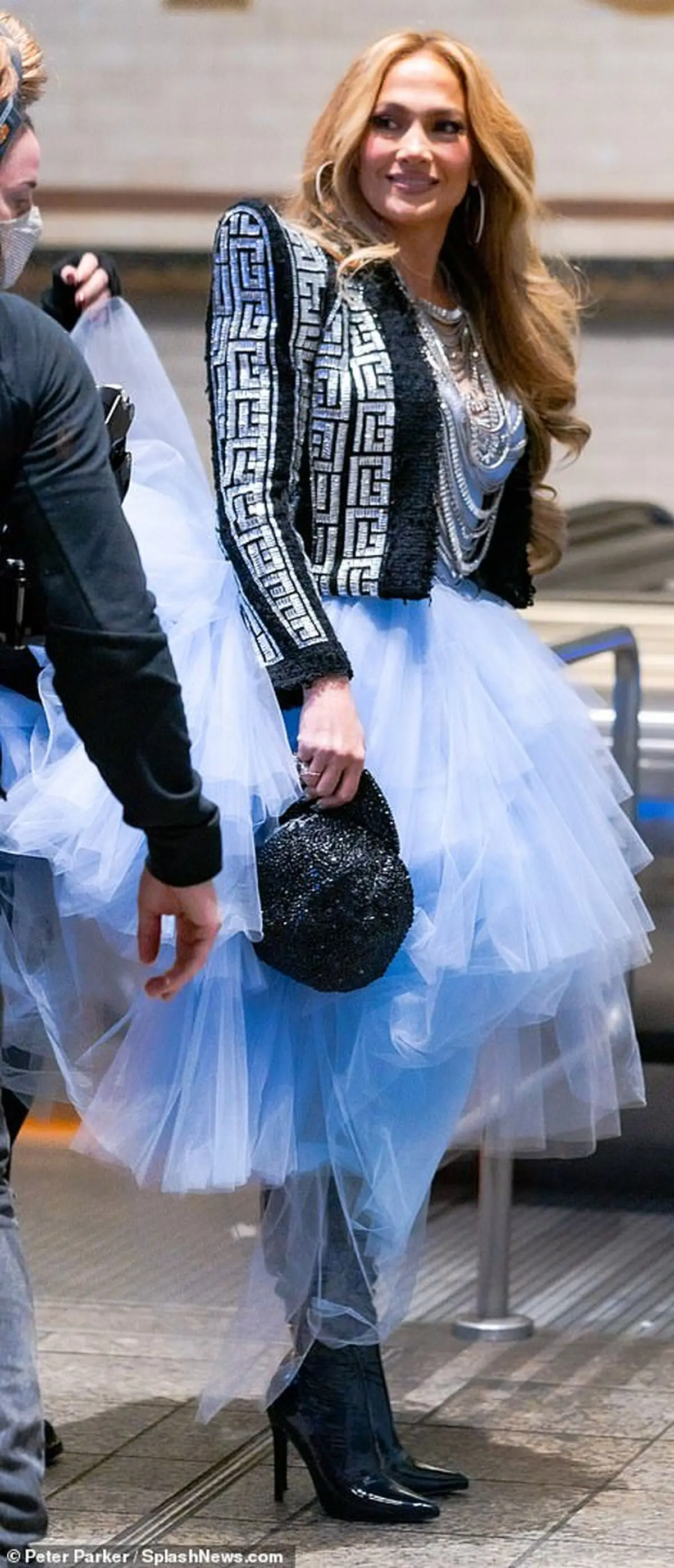 37418528-9099661-Hat_toss_She_carried_a_bedazzled_Yankees_cap_a_nod_to_her_home_t-m-81_1609351747091