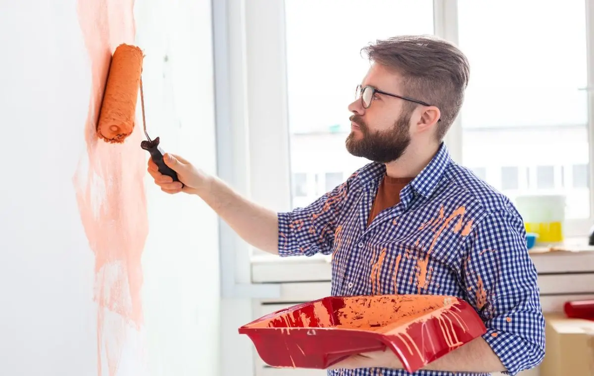 A-man-painting-a-wall