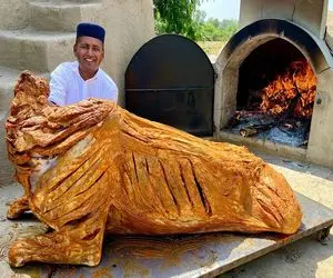 خلاقانه‌های آشپزی؛ سر گاو 200 کیلوییو از تنش جدا میکنن بعد مزه‌دار کردن درسته میپزنش