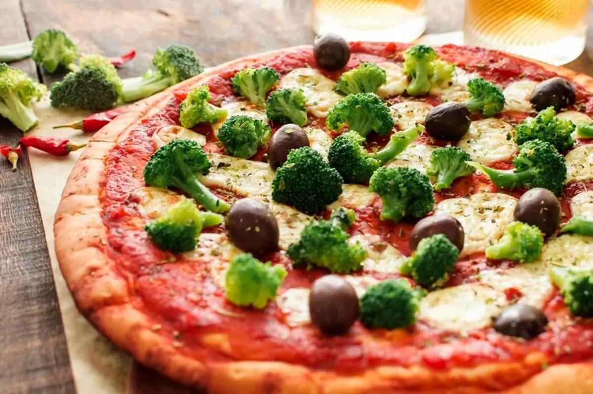 close-up-pizza-with-tomato-sauce-broccoli-olives-cheese_23-2147926043