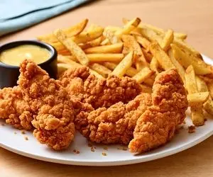 طرز تهیه مرغ سوخاری پولکی به روش کی اف سی؛ بهش چیکن استریپس هم میگن