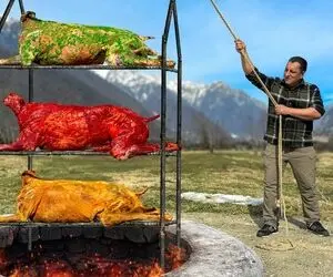 غذای روستایی؛ تو یه تنور سه طبقه زیر زمین سه عدد گوساله رو درسته بریان می کنن