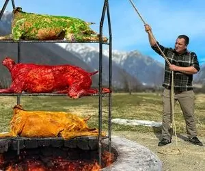 غذای روستایی؛ تو یه تنور سه طبقه زیر زمین سه عدد گوساله رو درسته بریان می کنن